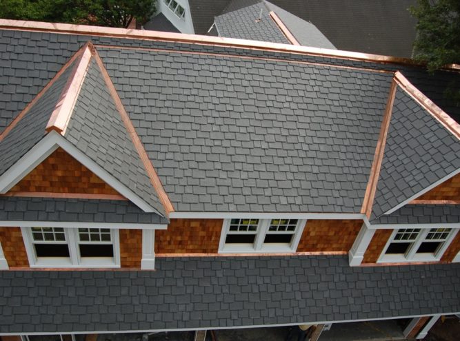 Slate roof with copper valleys, ridge and flashing detail