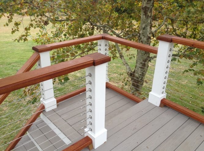 Composite deck with cable railing and wood cap